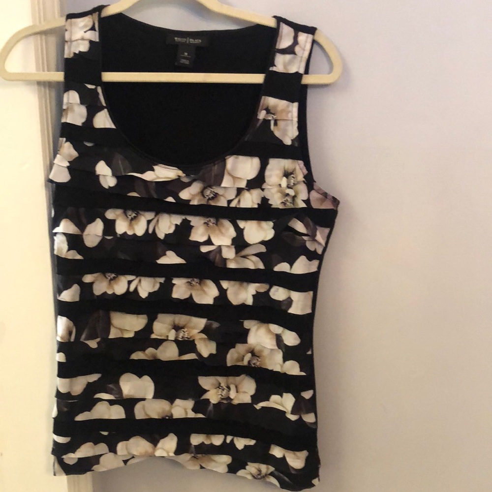 White House Black Market sleeveless top. Alternating layers of floral and black